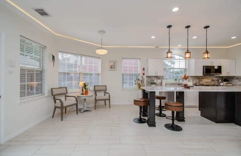 Fully equipped to serve all your cooking needs, this kitchen’s functional layout and expansive countertops were designed to unleash your culinary genius!