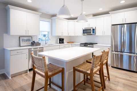 Fully Stocked Kitchen with Additional Bar Seating for 3