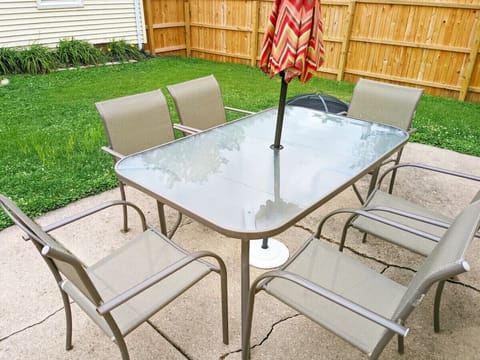 Outdoor patio dining table with umbrella