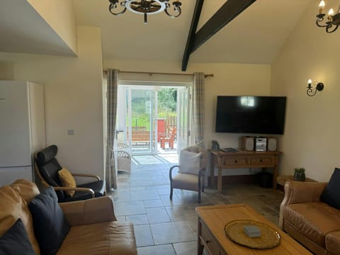 Patio doors leading from the sitting room to the conservatory