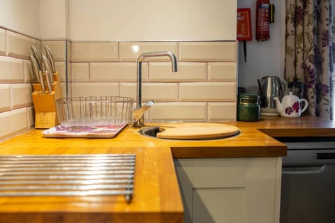 Sink with draining board and wooden work surfaces