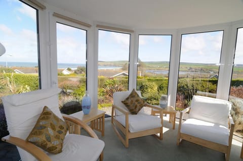 Sunny conservatory with views across to Newport beach