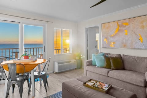 Let the sunrise fill the space as you ease into the day. Designed for comfort and connection, this open living area invites slow mornings and peaceful coastal living.