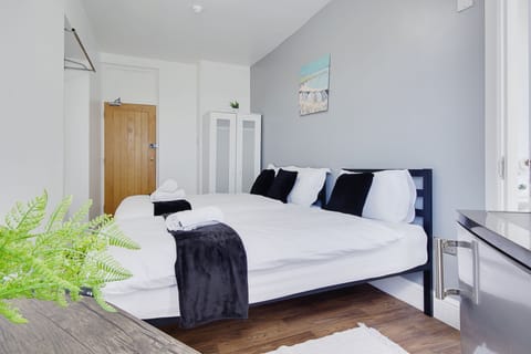 Premium Triple Room, City View | Premium bedding, down comforters, memory foam beds, desk