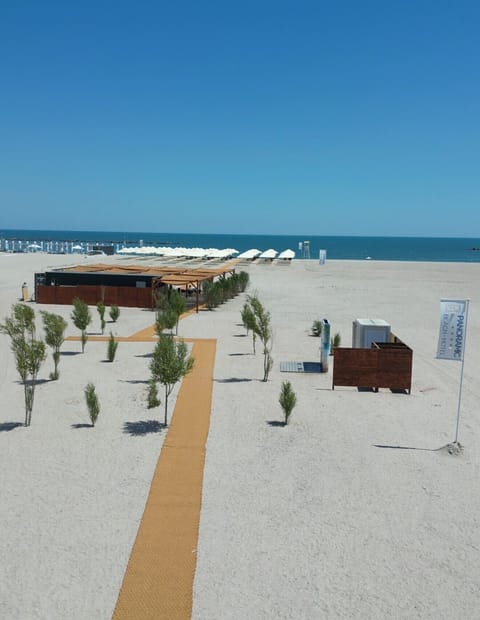 Private beach nearby, beach umbrellas, beach towels, beach bar