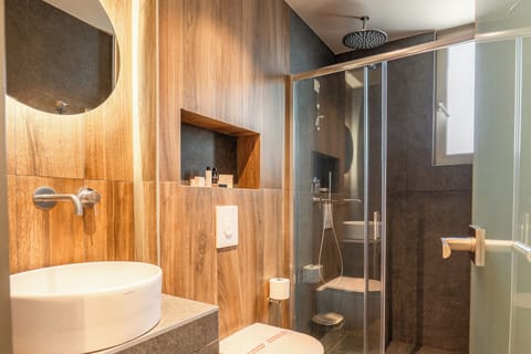 Shower, hair dryer, slippers, towels