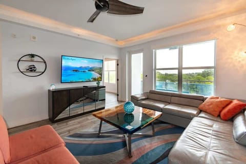 Modern living room with large windows and a balcony view