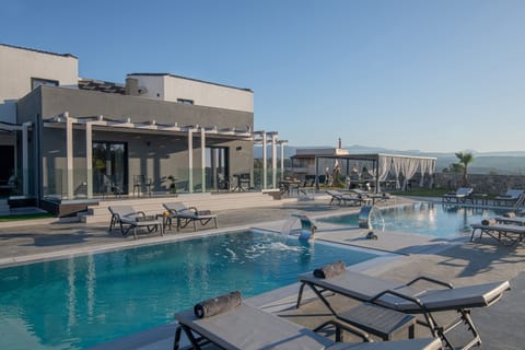 The lux villa features multiple outdoor sunloungers to cherish with loved ones.