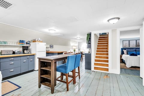 Overview of the 2nd floor, queen bedroom, and stairs leading to the 3rd floor. 