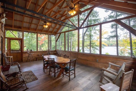 Enormous screened porch overlooks the pond