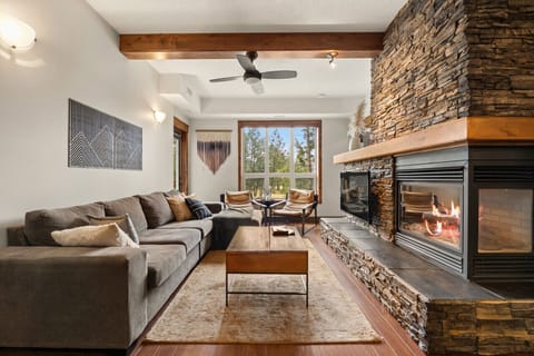 Living room with a gas fireplace, Smart TV with cable & cozy seating options