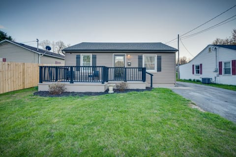 Another view of the front  shows the spacious front porch and and ample parking.
