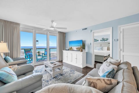 Relax in your spacious oceanfront living room with stunning sea views, comfortable seating, and a peaceful coastal ambiance.
