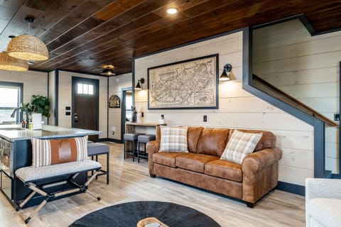 Discover our bright and spacious living area with stylish seating and easy access to the kitchen and dining spaces.