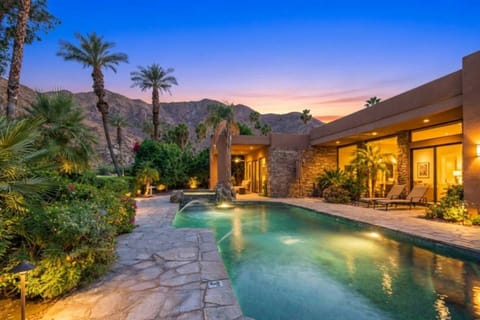 Unwind in your private Palm Springs oasis, mountain views, glowing pool, and serene indoor-outdoor living made for unforgettable desert nights.