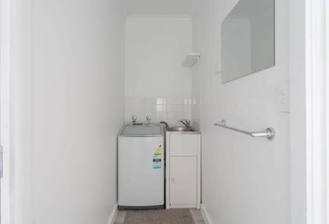 Enter into the laundry and separate toilet