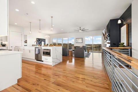 The first living space offers cozy and modern seating, a large Smart TV and a telescope.