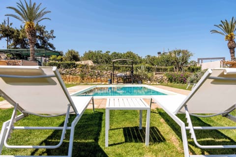 Relax by the pool on comfortable sun loungers and enjoy the peaceful surroundings.