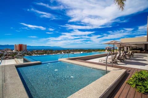 Roma Encore amenities include an infinity pool, a children's pool, gym and BBQ area, all with amazing scenic views