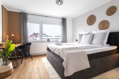 Family Apartment, 2 Bedrooms | Living area | 43-inch flat-screen TV with cable channels
