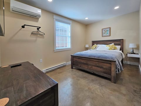 Bedroom with Queen bed, AC, and a 55 inch Smart TV