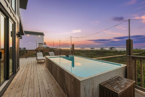 Soak in the colors of the sunset while enjoying your private heated pool oasis.