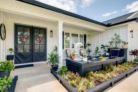 Front porch with pond, waterfalls and well landscaping garden