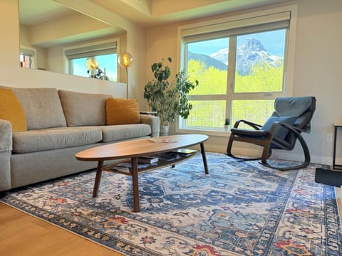 Living Room w Sofa Bed, Smart TV, Electric Fireplace and Beautiful Window View.