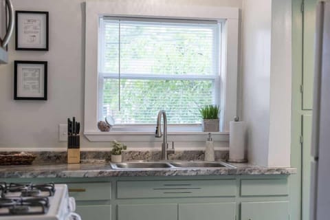 Double basin kitchen sink area with plenty of natural light and counter space for preparing meals. 🍽️☀️