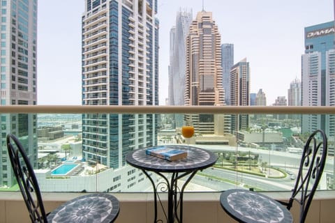 Balcony Oasis: Sip a drink on the terrace with stunning skyline views of Dubai!