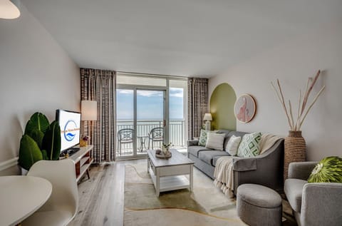 Cozy living room with ocean-view balcony and relaxing atmosphere