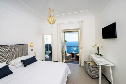 Double Room, Sea View | Minibar, in-room safe, desk, laptop workspace