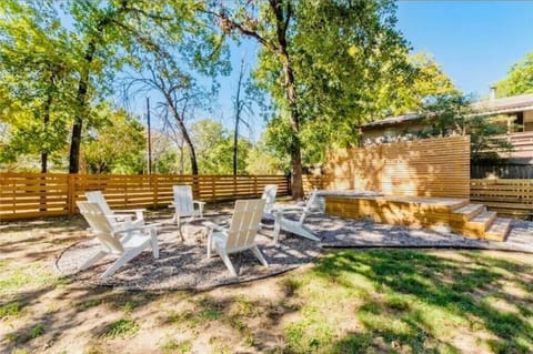 Backyard with firepit, grill, cowboy pool.