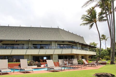 Oceanfront terrace area offering poolside relaxation under the sun.