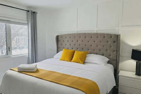 King size bed featuring a comfortable mattress, and high quality bedding
