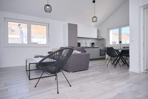 Apartment, Balcony, Bay View | Living area | 60-inch Smart TV with cable channels