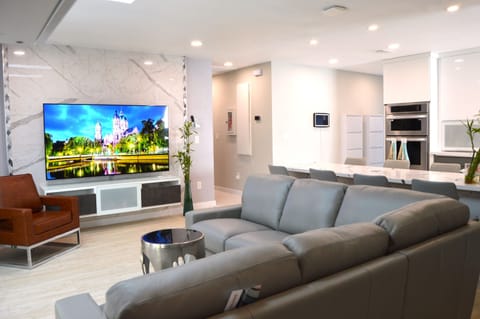 Modern living room: 72 inches smart TV on an accent wall 