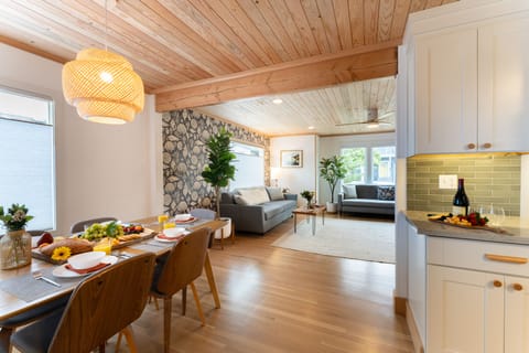 Living room opens to the dining area and kitchen.