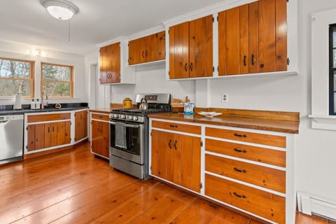 Fully-stocked kitchen with all the appliances & utensils you might need to cook at home.