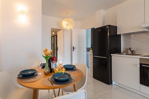 You'll love the dining room with its gorgeous wooden table for four and the fully equipped kitchen with beautiful white furniture.