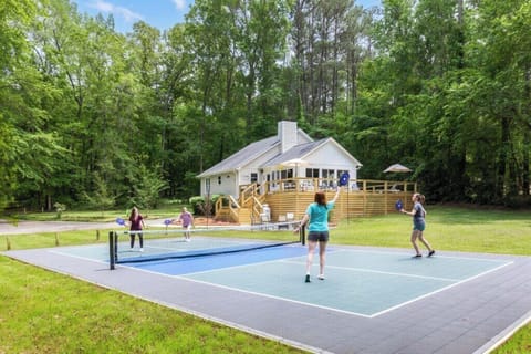 Show your competitive side on this private lakeside pickleball court 