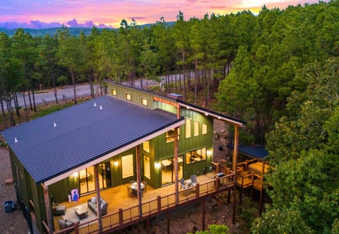 Nestled in the trees, this luxury cabin offers privacy, comfort, and incredible views of the surrounding forest.