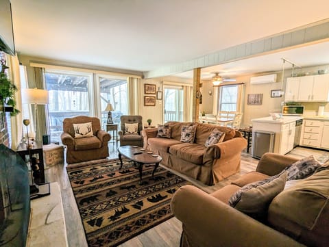 Living space flooded with natural light and ample seating.