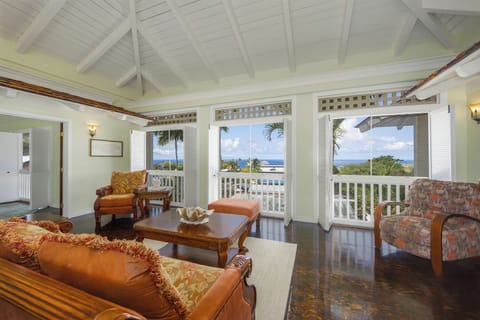 This airy living room blends island charm with comfort and ocean views.