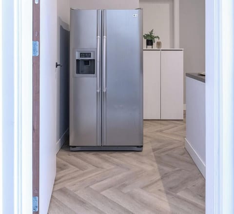 communal/shared kitchen with fridge and microwave.