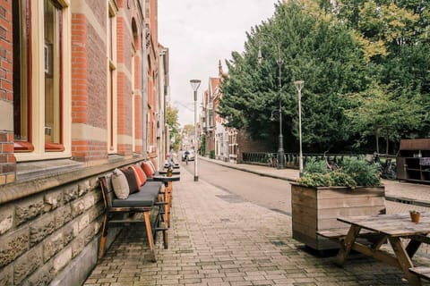 Scenic street view lined with greenery, offering a peaceful and charming environment for a pleasant stroll.