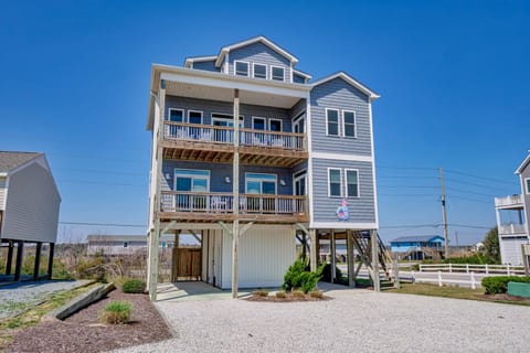 A spacious, elevated coastal home with multiple balconies and scenic ocean views