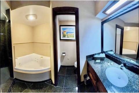 Exclusive Suite, 2 Bedrooms, Jetted Tub | In-room safe, soundproofing, iron/ironing board, free WiFi