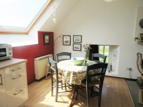 Dining area with round table and four chairs