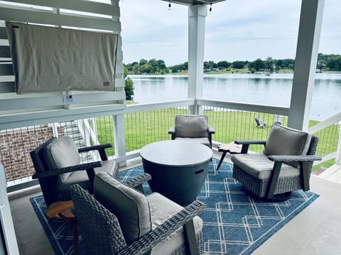 Comfortable lounging or watching the game overlooking the water on the first floor porch.